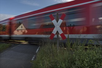 Train driving over an ungated level crossing