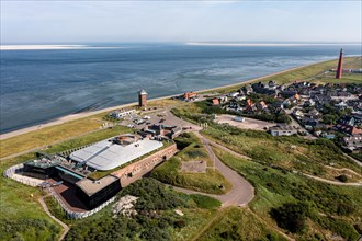 Drone shot from Fort Kijkduin over the village of New Den Helder to the lighthouse Huisduinen