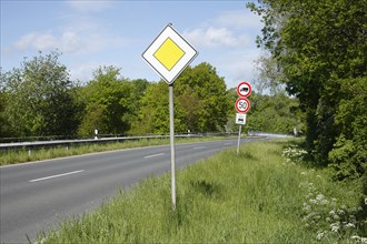 Road sign "Vorfahrtstraße" on a country road