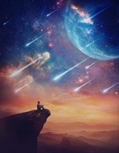 Lone person on the peak of a cliff admiring a wonderful space phenomenon. Fantastic scenery with falling stars and colorful nebulas above the sunset. Inspirational imaginary landscape