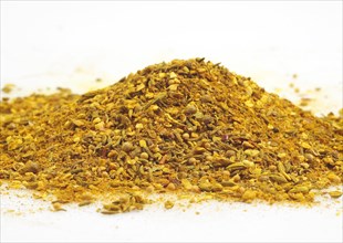 CURRY POWDER AGAINST WHITE BACKGROUND