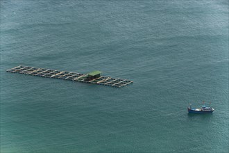 Fishing boat with fish traps in the China Sea