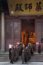 Devout monks leaving a temple