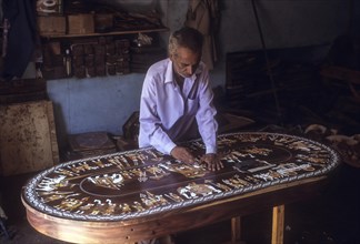 Man making inlay work
