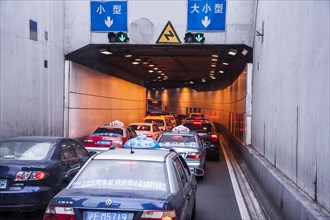 Cars driving into a tunnel
