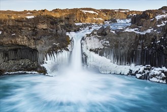 Aldeyjarfoss waterfall by the SkjsslfandafljÂ¾t river in winter in the north-eastern region