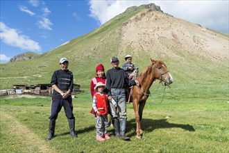 Kyrgyz family with horse