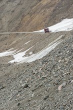 Truck passing the Chong Ashuu pass at 3800 m altitude