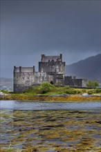 Eilean Donan Castle in Loch Duich during a rainstorm