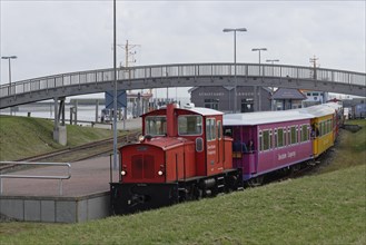 Island train leaves station at harbour