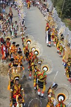 Naga tribesmen participating in the stone-pulling ceremony during the Kisima Nagaland Hornbill Festival