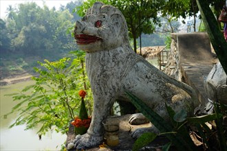 Lion statue on the Nam Khan promenade