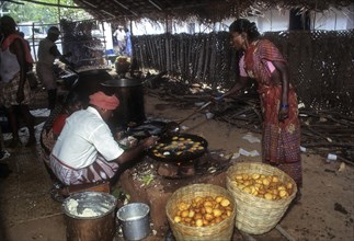 Preparing a sweet appam for Nattukottai Chettiar Nagarathar wedding feast in Chettinad