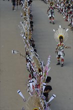 Naga tribesmen participating in the stone-pulling ceremony during the Kisima Nagaland Hornbill Festival