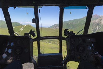 Aerial view from a helicopter cockpit over the central Tian Shan Mountains