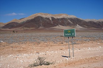 Road sign and landscape on the C14 road to Solitaire