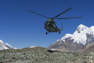 Helicopter landing at Khan Tengri Base Camp