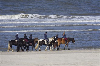 Riders on the beach of Langeoog