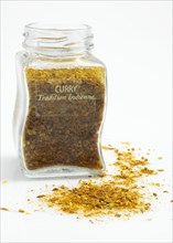 CURRY POWDER AGAINST WHITE BACKGROUND