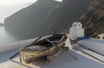 Old rowing boat on terrace roof
