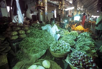 Vegetables under green light Koyambedu whole sale vegetable and fruit market is one of Asia's largest perishable goods market complex located in Chennai Madras