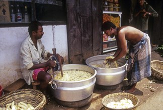 Men preparing banana to make banana chips at Palakkad Palghat
