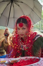 Nepalese bride from the Tharu ethnic group in traditional dress
