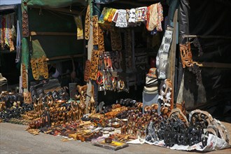 Souvenir stalls with carved animal figures and souvenirs