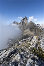 View of the solid cloud-covered summit and ridge of the Partenkirchner Dreitorspitze