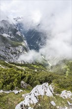 View of the cloud-covered Reintal valley and the peaks of the Wetterstein mountains