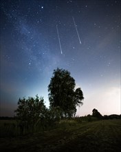 Two shooting stars with milky way in Brandenburg
