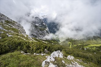 View of the cloud-covered Reintal valley and the peaks of the Wetterstein mountains
