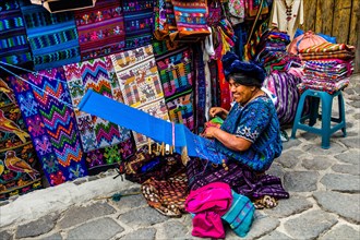 Woman weaving with loom