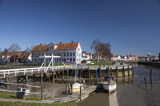 The old historic white bridge over the Toenning peat harbour