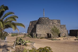 Old fortress on the beach promenade of Caleta de Fuste