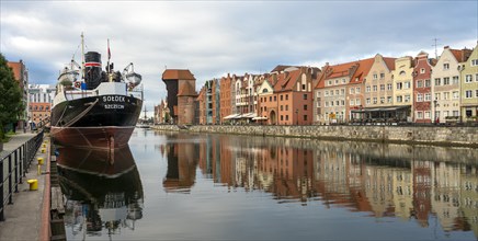 The old town of Gdansk with the first tanker built at the Gdansk shipyard