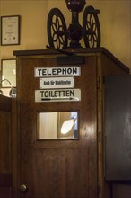 Old telephone booth in coffee house