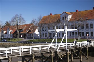 The old historic white bridge over the Toenning peat harbour