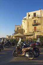 Vespas on the outskirts of the old town of Cefalu