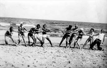 Group with bathers on the beach