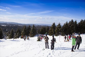 Group of hikers on the snow-covered Brocken in the Harz mountains