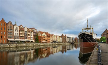 The old town of Gdansk with the first tanker built at the Gdansk shipyard