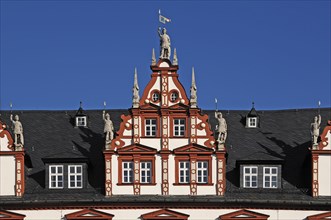 Decorative roof gable with sculptures on the town house