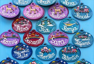 Colourful and decorative ceramic name badges