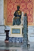 Bronze statue of Saint Peter on marble pedestal in St