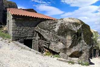 Old stone houses between rocks