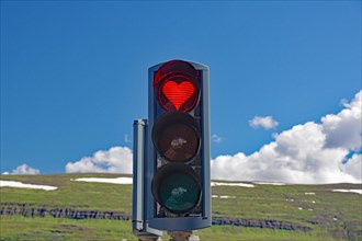 Traffic lights with red heart