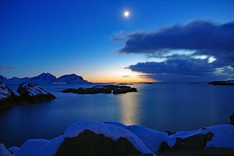 Full moon over fjord