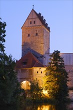 Illuminated Rothenburg Gate at dusk