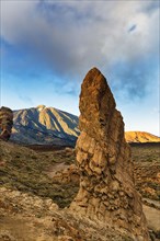 Bizarrely shaped tower of volcanic rock in front of Teide Volcano